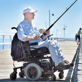 Hands-On adaptive fishing rod holder for under wheelchair seat - man in wheelchair on pier hand cranked reel