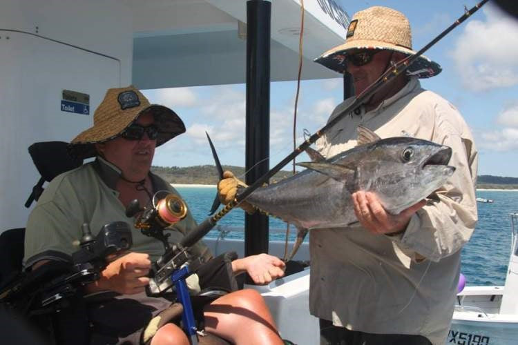 Hands-on adaptive wheelchair fishing rod holder-quadriplegic man caught bluefin tuna